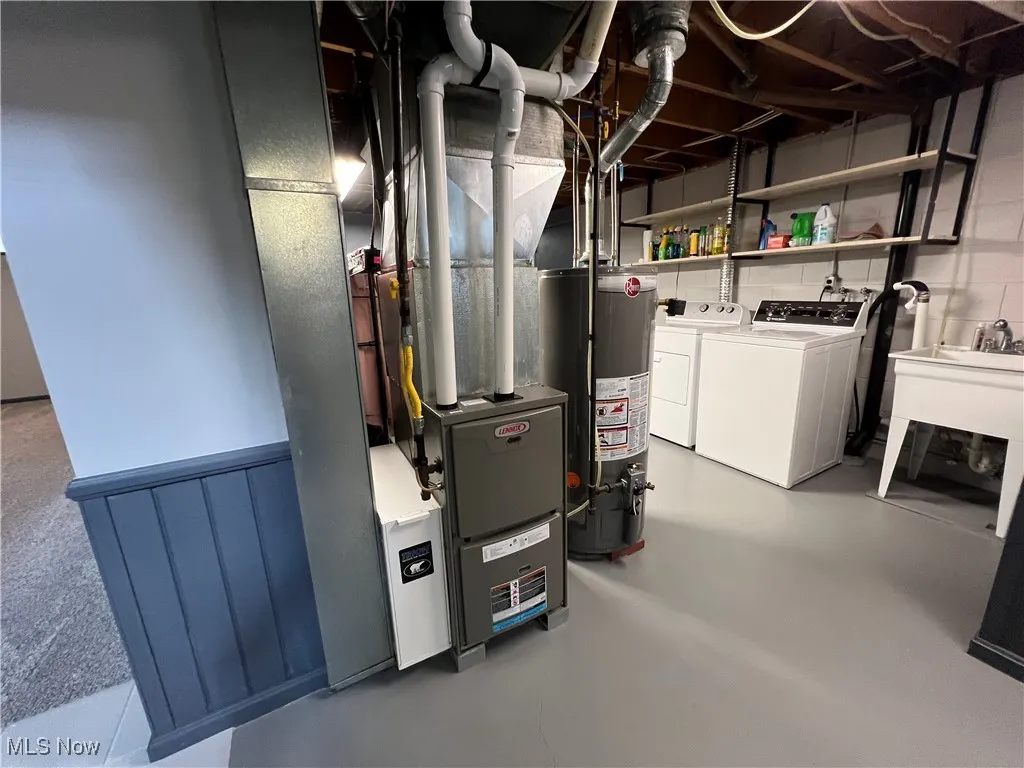 Unfinished below grade area with independent washer and dryer and water heater