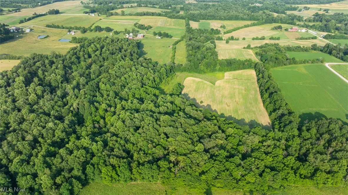 Aerial view of property and surrounding area with rural landscape