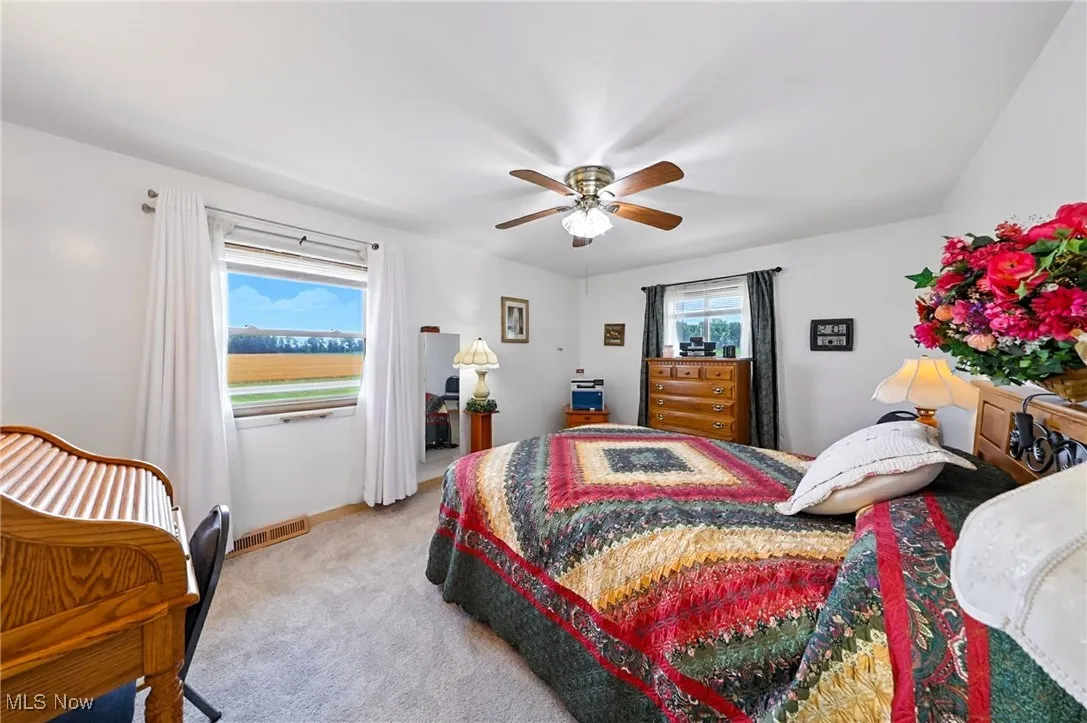 Bedroom featuring carpet floors and a ceiling fan