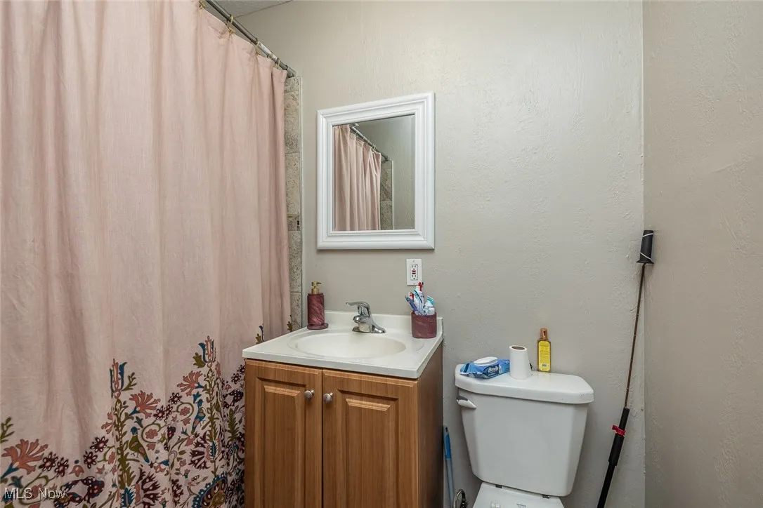 Bathroom with vanity and a shower with curtain