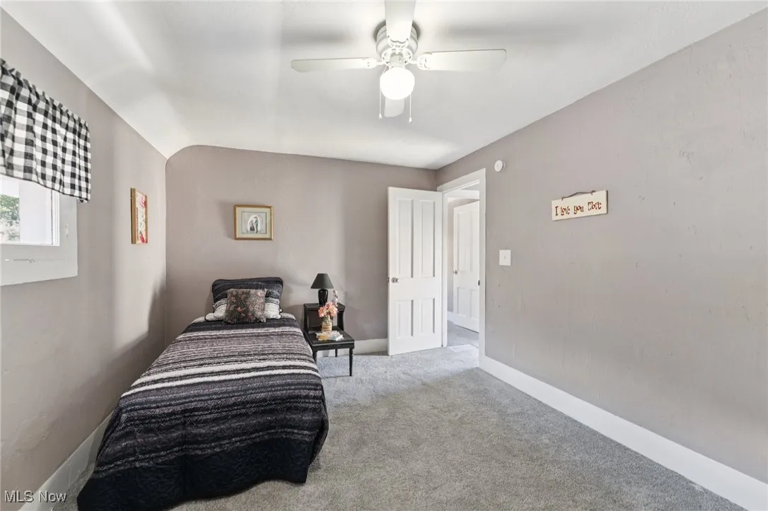 Bedroom with carpet flooring and a ceiling fan