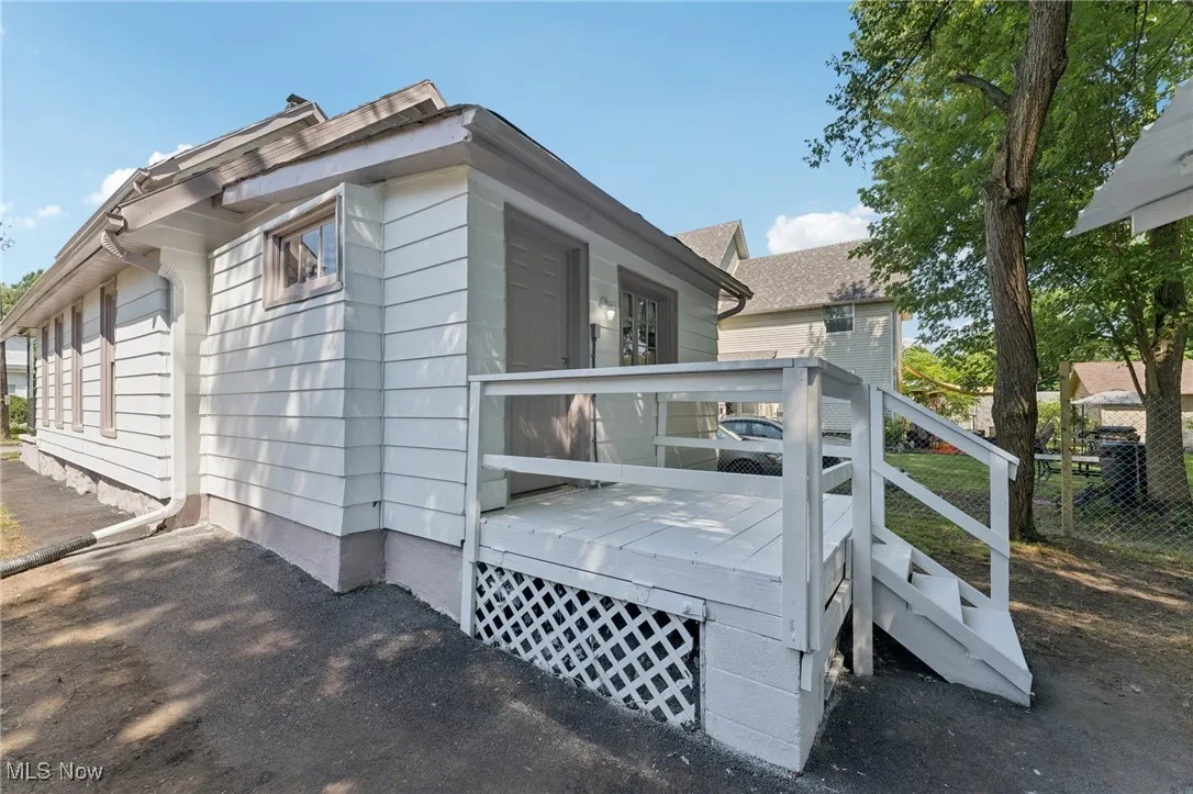View of side of home with a deck