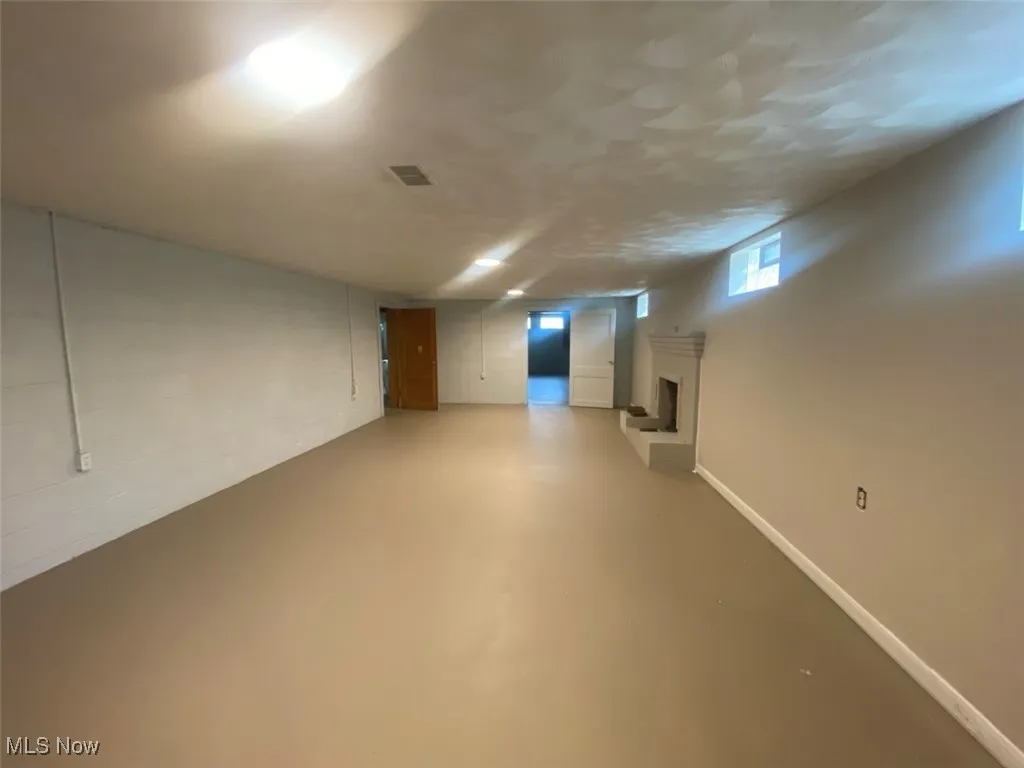 Below grade area featuring a fireplace