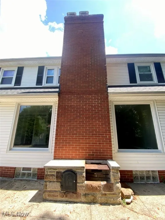 View of home's exterior with a chimney