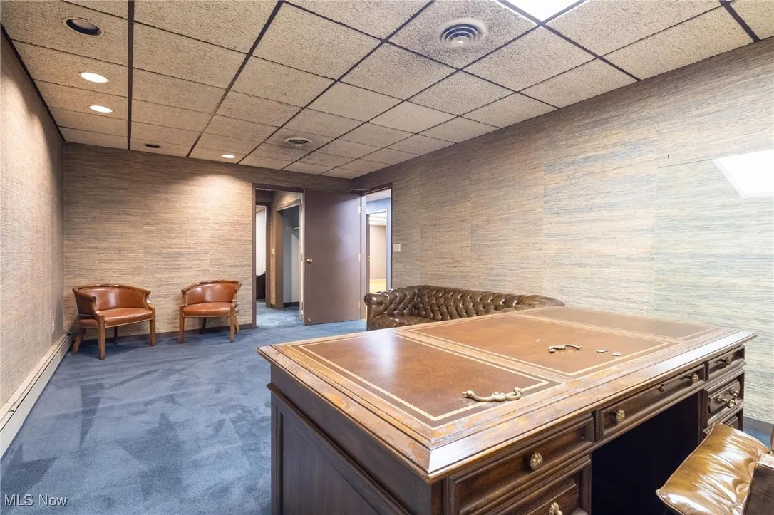 Office featuring baseboard heating, carpet flooring, a paneled ceiling, and recessed lighting