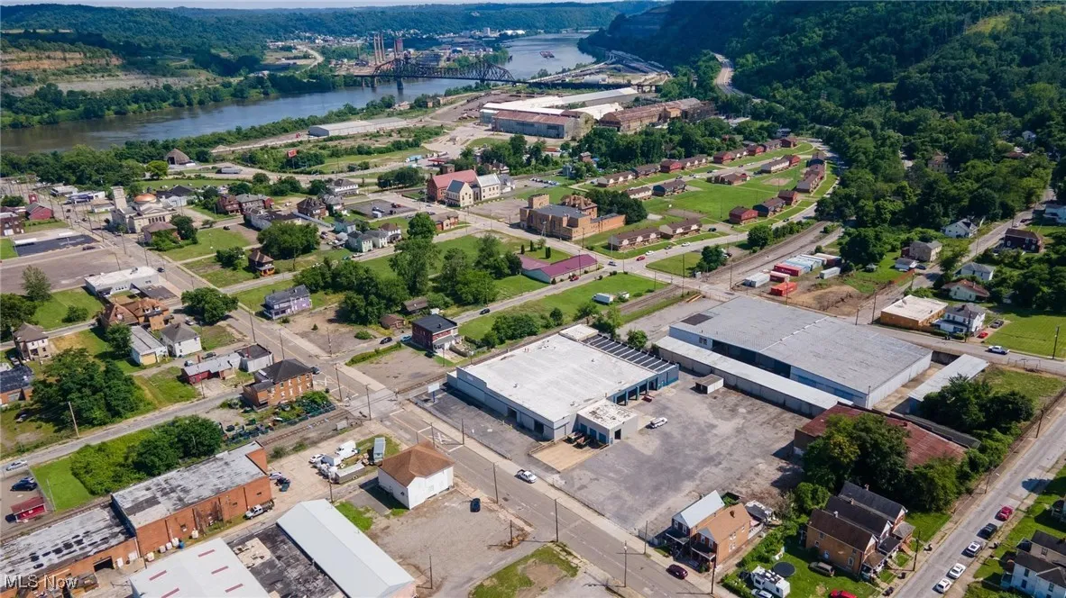 Aerial view of property's location with a nearby body of water