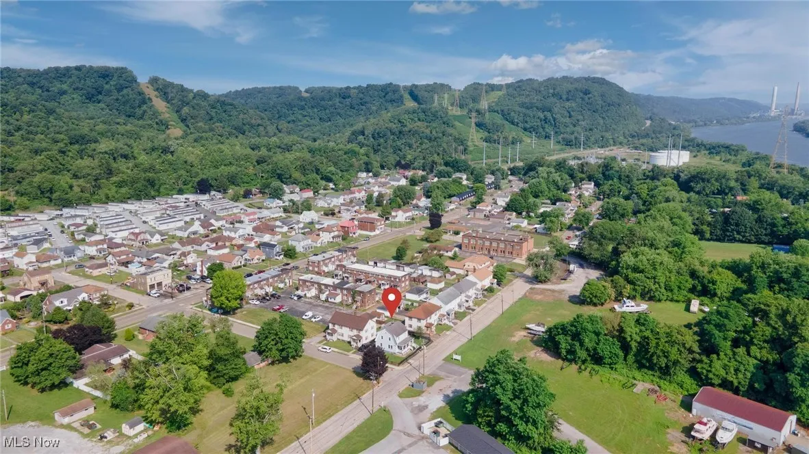 View of property location featuring a heavily wooded area