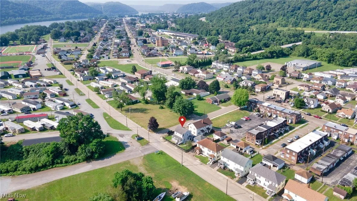 Aerial overview of property's location with nearby suburban area