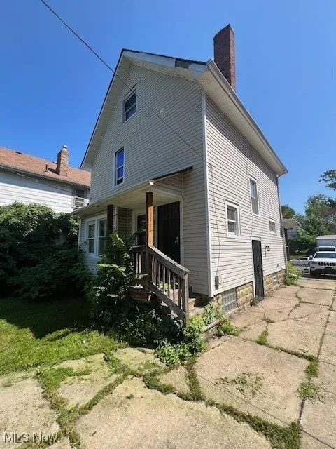 Rear view of house with a chimney