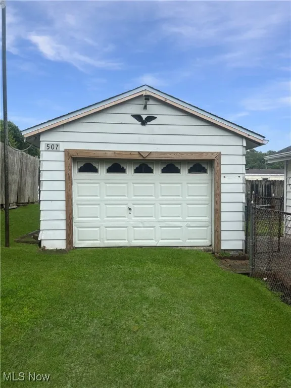Garage featuring driveway