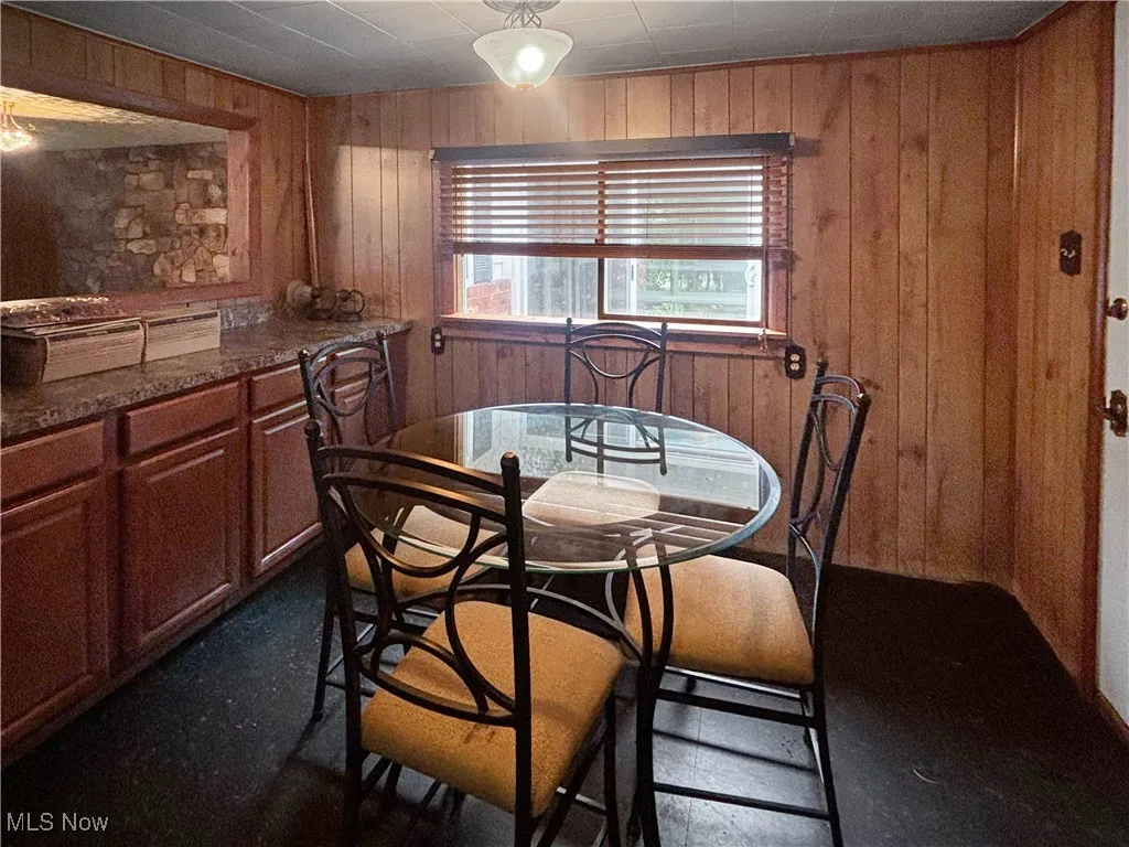 Dining area with wood walls