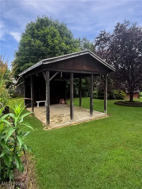 View of property's community with a yard and a gazebo