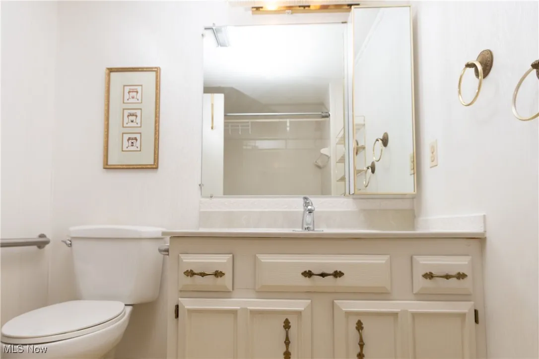 Guest bathroom with customized vanity (ceramic countertop). The elevated toilet seat also have safety bars on both sides. The tub was converted to walk in shower.
