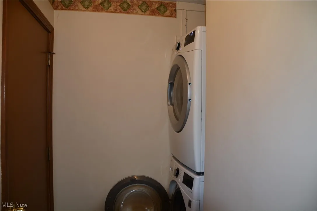 Laundry room with estacked washer and dryer