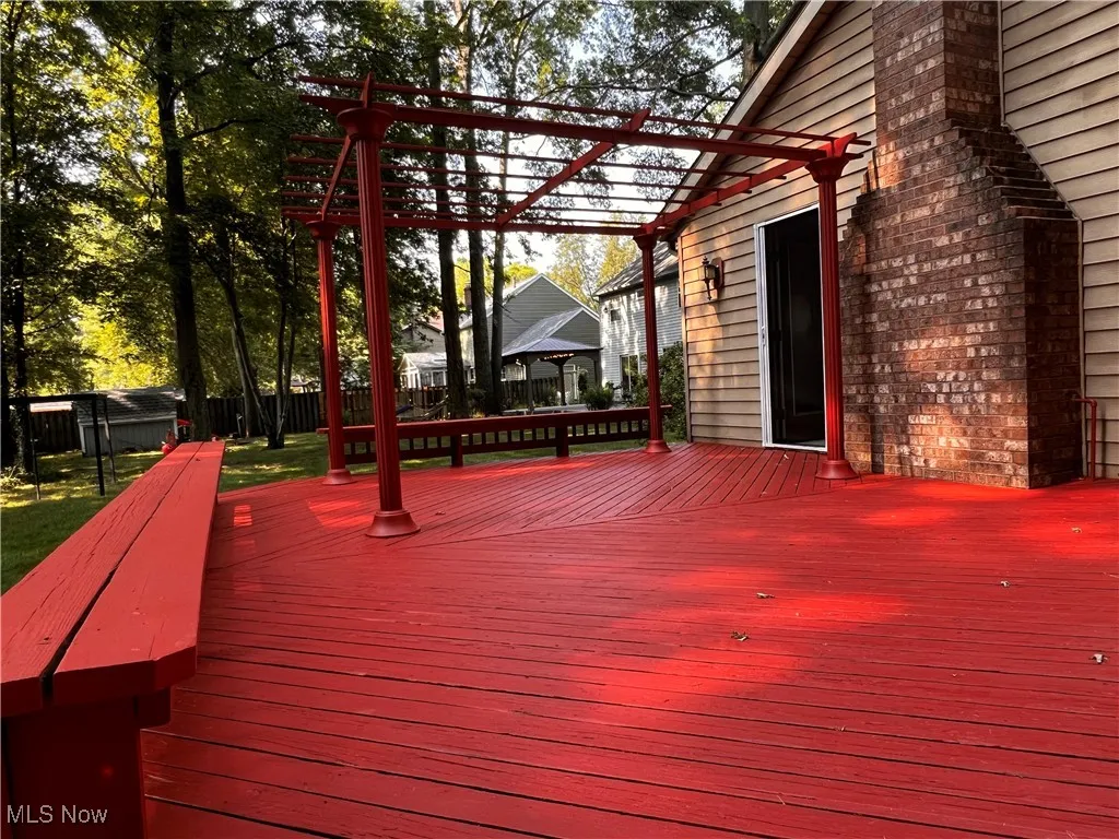 Deck featuring a pergola