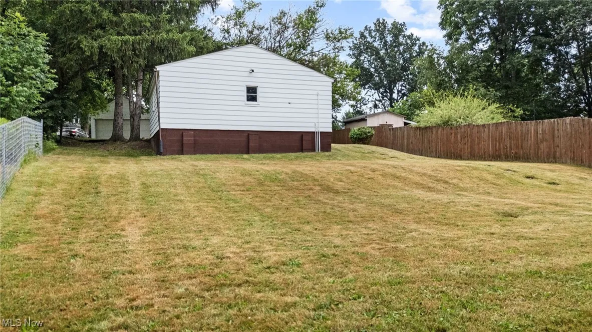 View of yard & access to detached garage