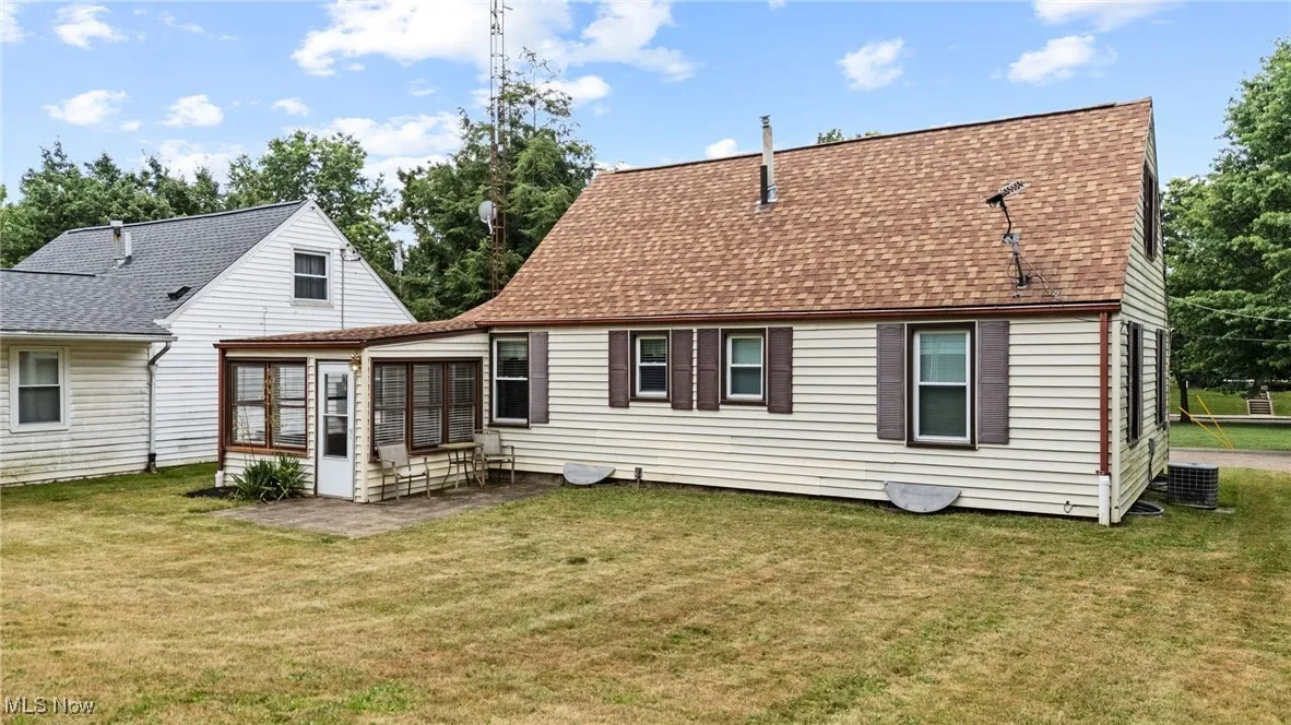 Back of property with a 170' deep yard, and a sunroom