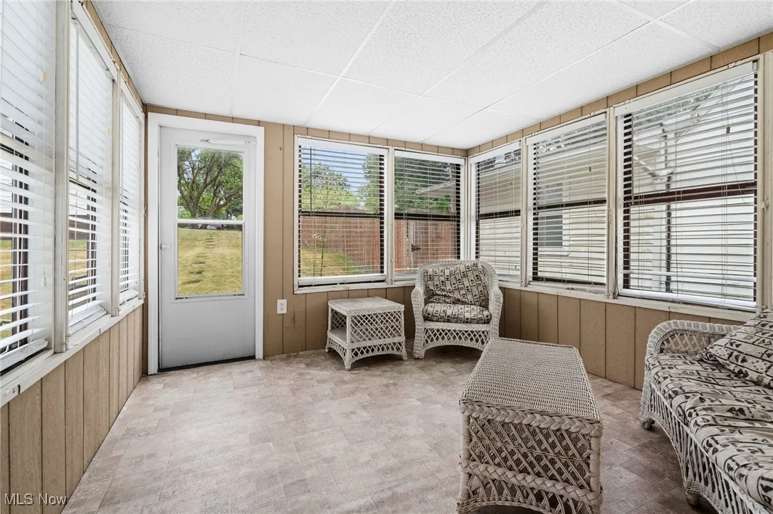 Sunroom / solarium featuring healthy amount of natural light