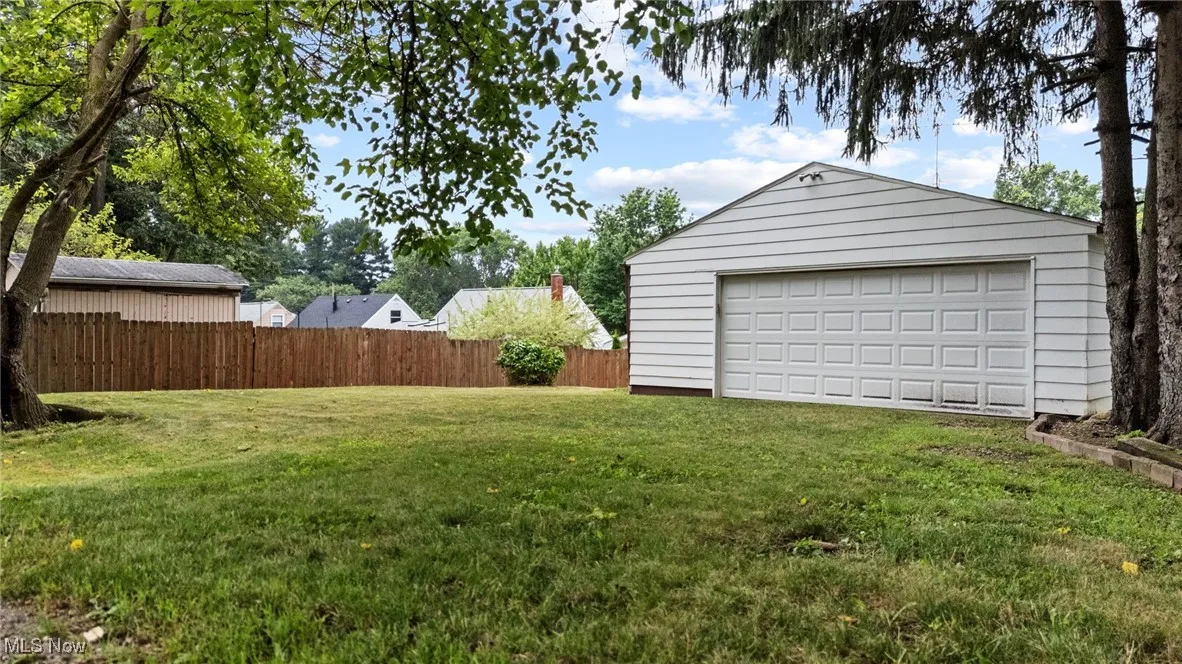View of yard featuring a 2 car detached garage