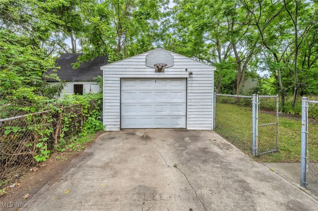 Detached garage with concrete driveway