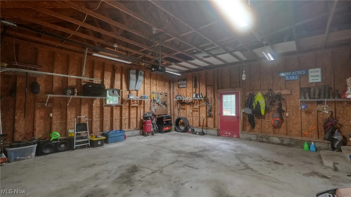 Garage featuring a garage door opener