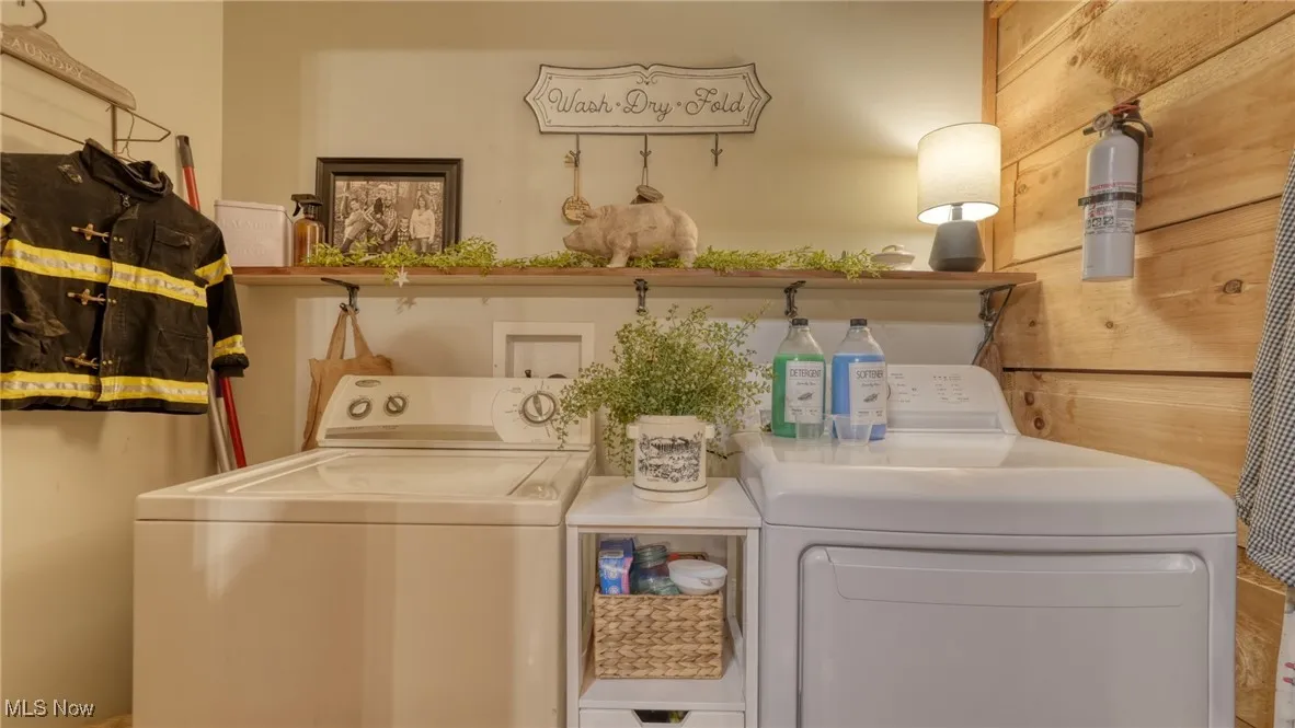 Laundry area featuring separate washer and dryer