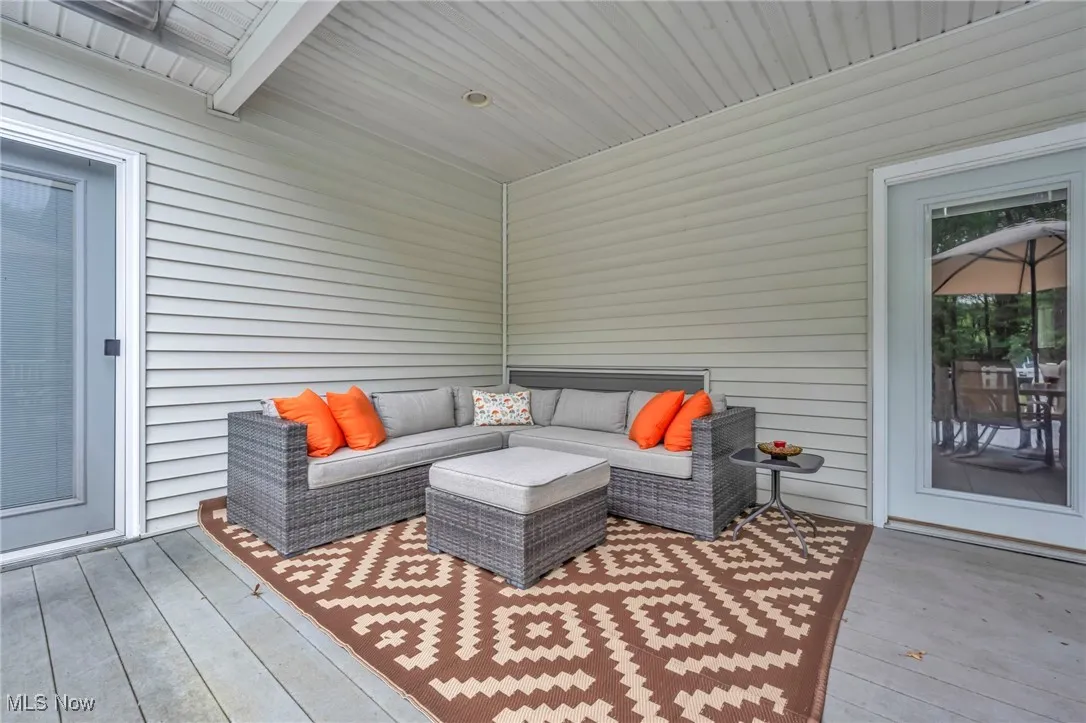 Wooden terrace featuring an outdoor hangout area