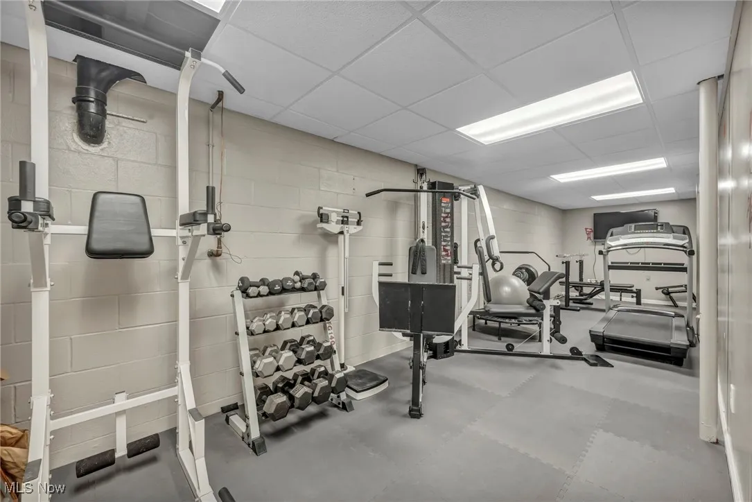 Exercise area featuring concrete block wall