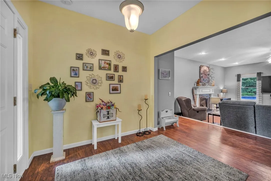 Entryway with a fireplace and wood finished floors