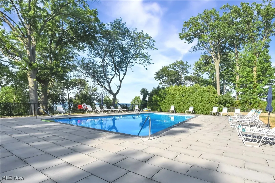 Community pool with a patio