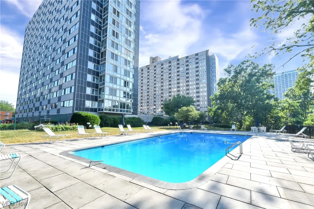 Community pool with a patio