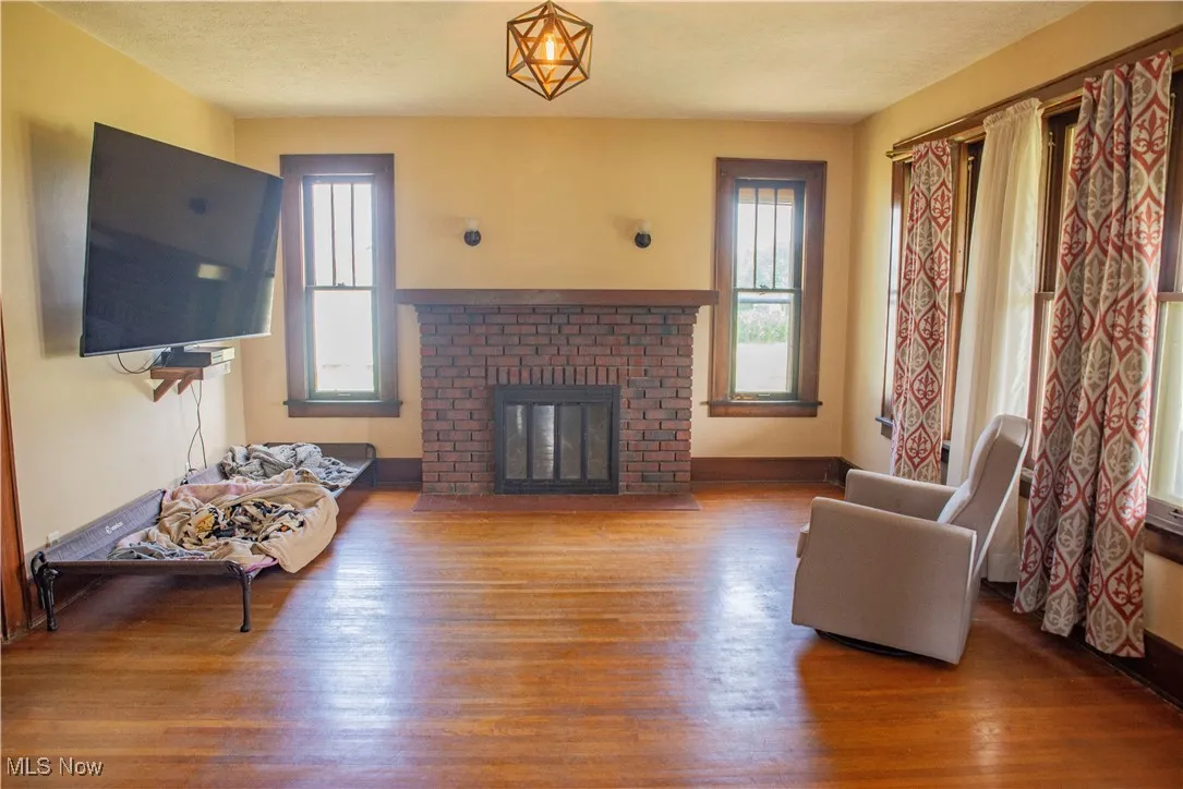 Living room featuring wood finished floors and a fireplace