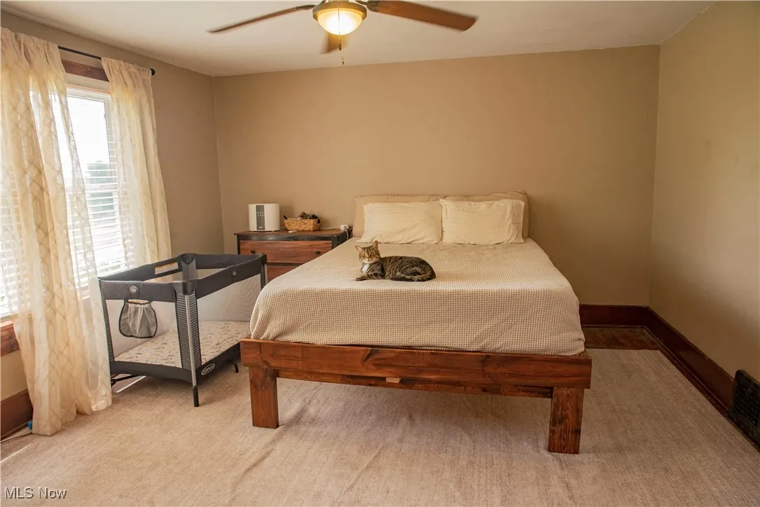 Bedroom featuring a ceiling fan