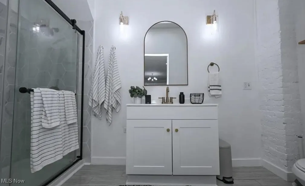 Bathroom with vanity and a stall shower