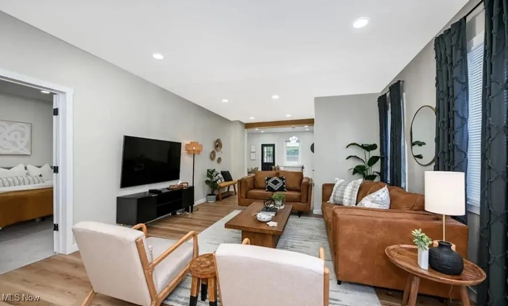 Living area featuring light wood-type flooring and recessed lighting