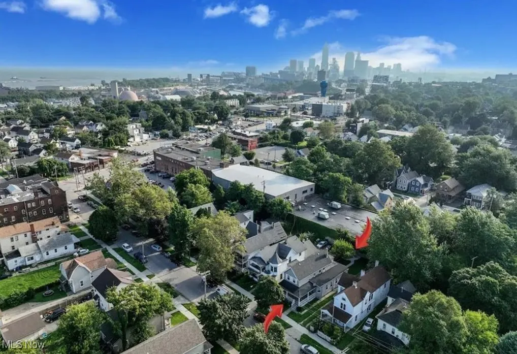 Aerial overview of property's location featuring city skyline