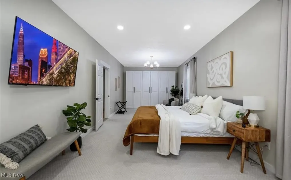Bedroom featuring a chandelier, carpet flooring, a closet, and recessed lighting
