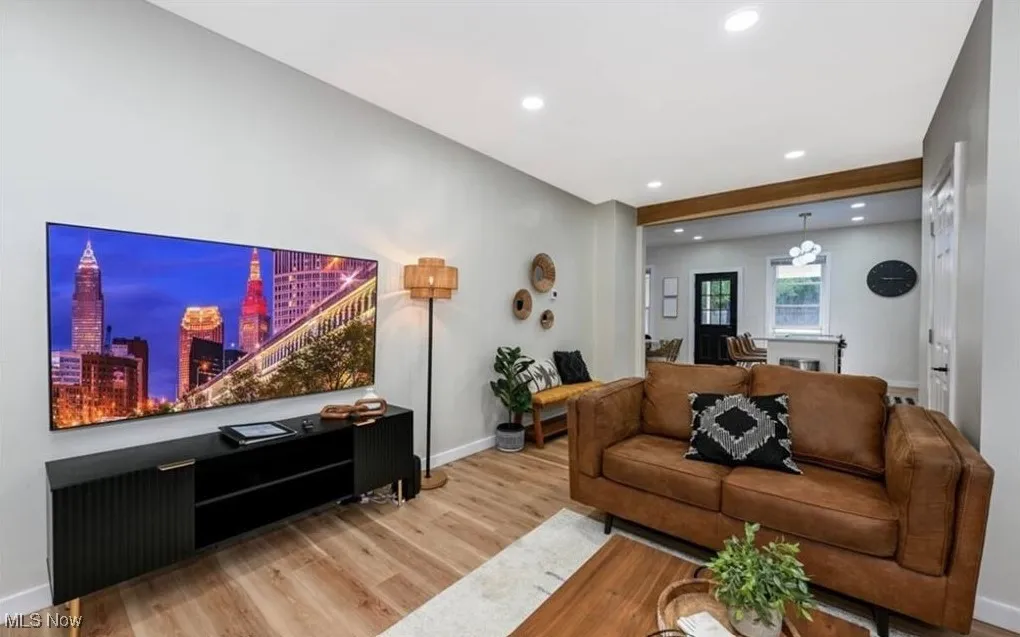 Living room featuring wood finished floors and recessed lighting
