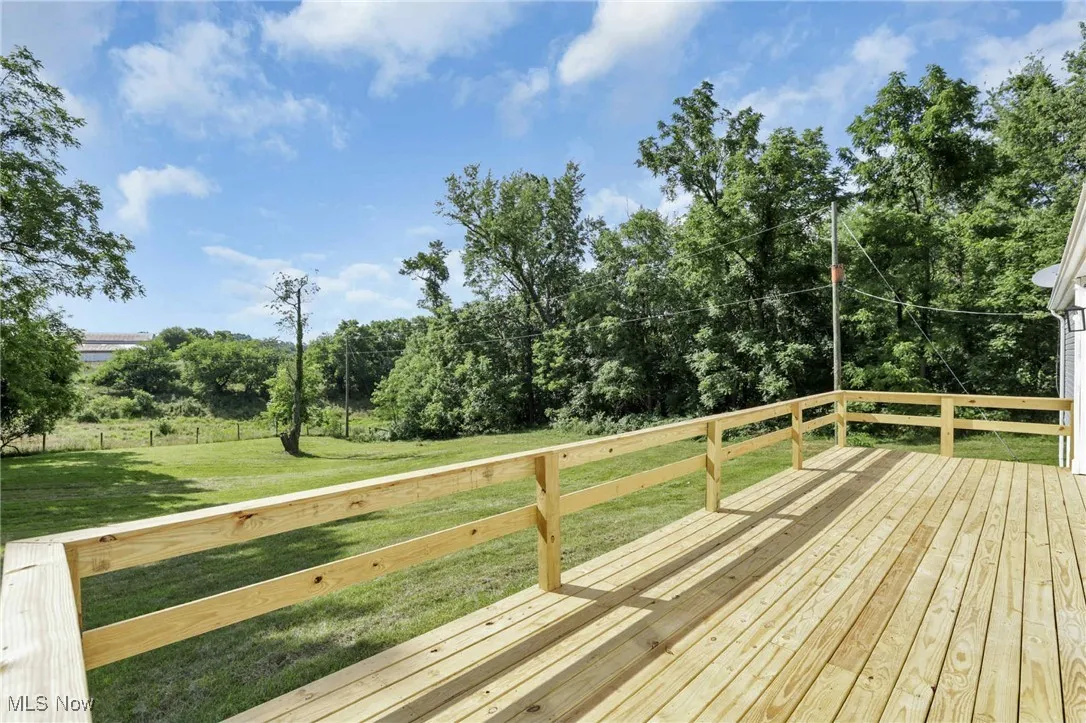 Wooden terrace with a yard