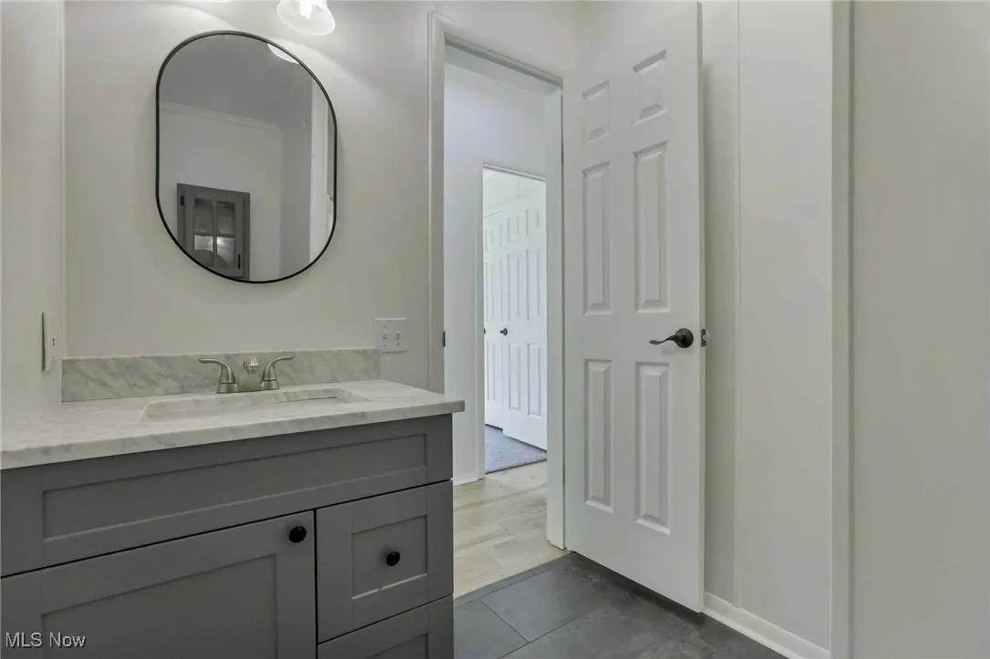 Bathroom with vanity and tile patterned floors