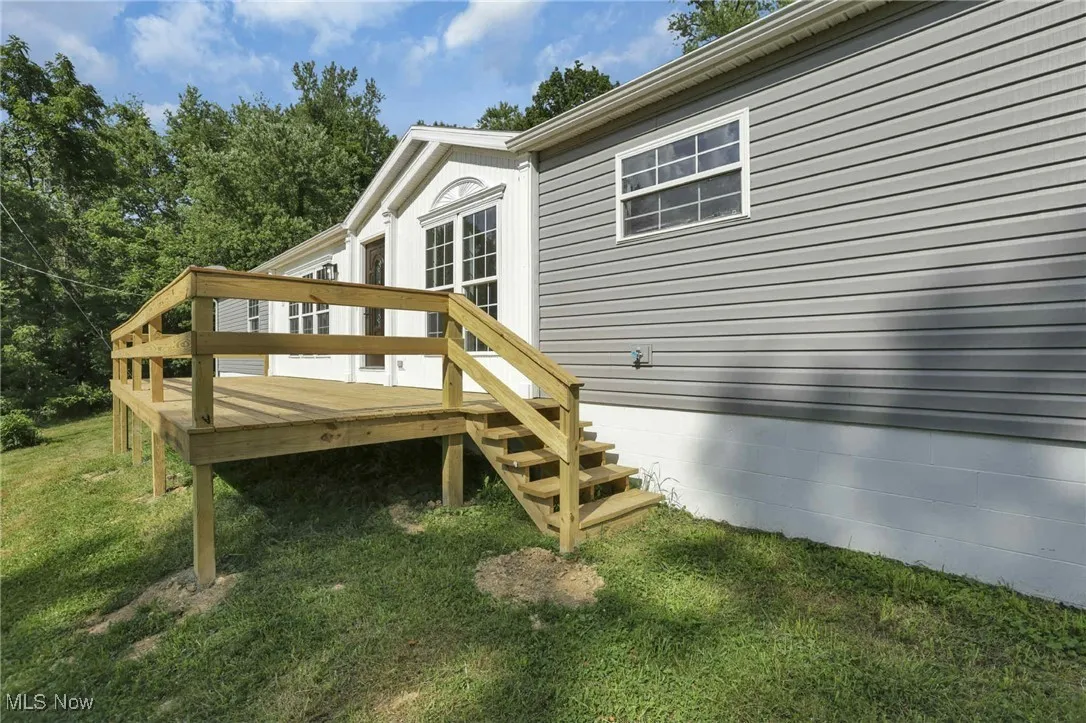 Wooden terrace with a yard