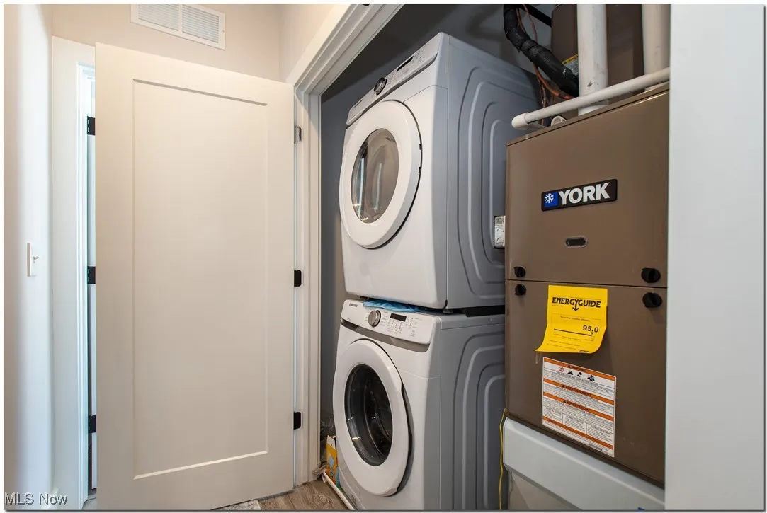 Between the bedrooms are the stacked washer and dryer and mechanicals