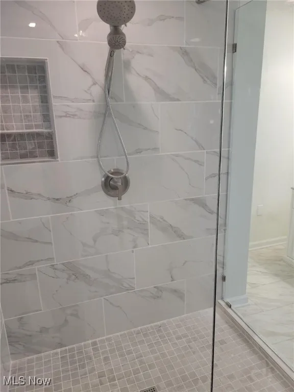 Bathroom with tiled shower