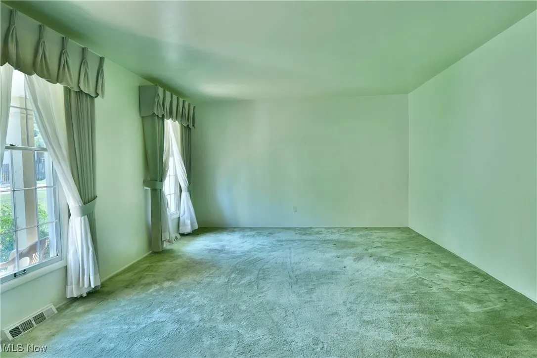 Empty room featuring carpet floors
