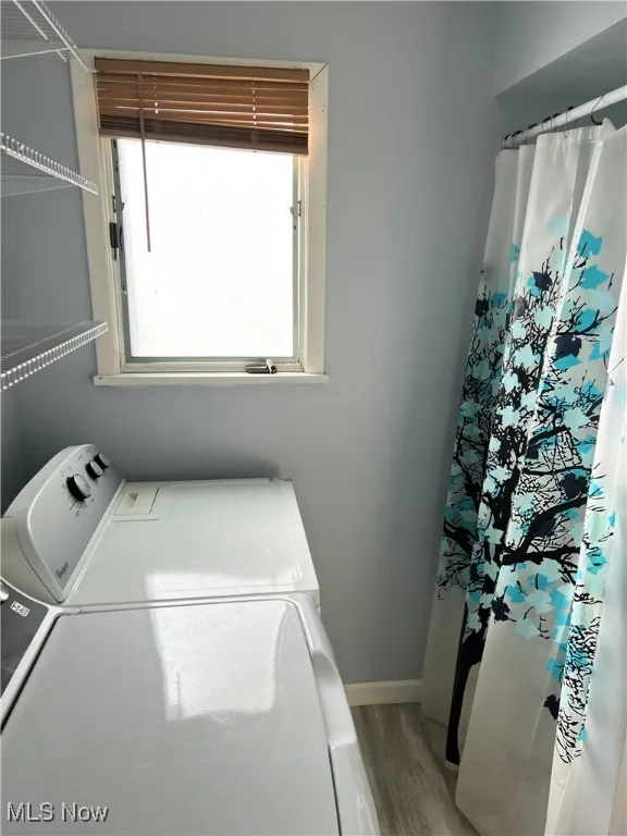 Main floor laundry/bathroom with shower