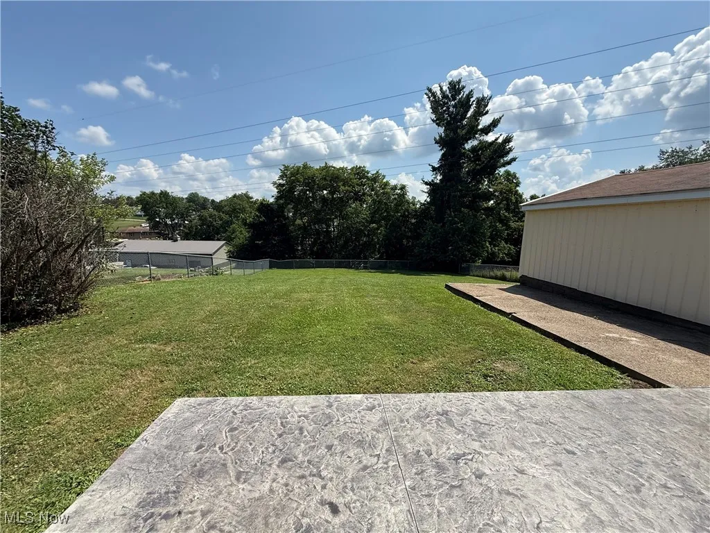 View of yard with a patio area
