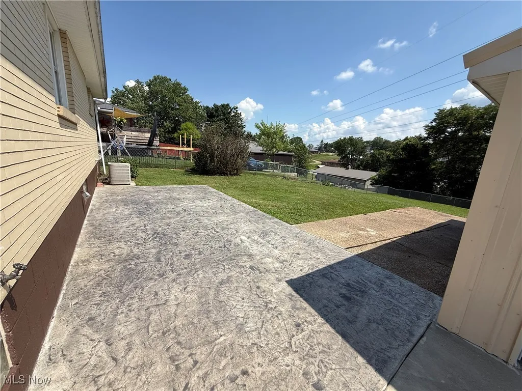 View of yard with a patio