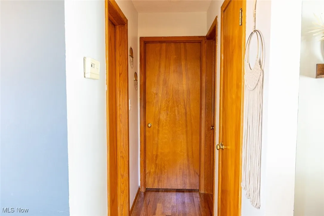 Hall featuring wood finished floors