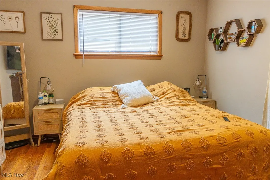 Bedroom 1 with wood finished floors
