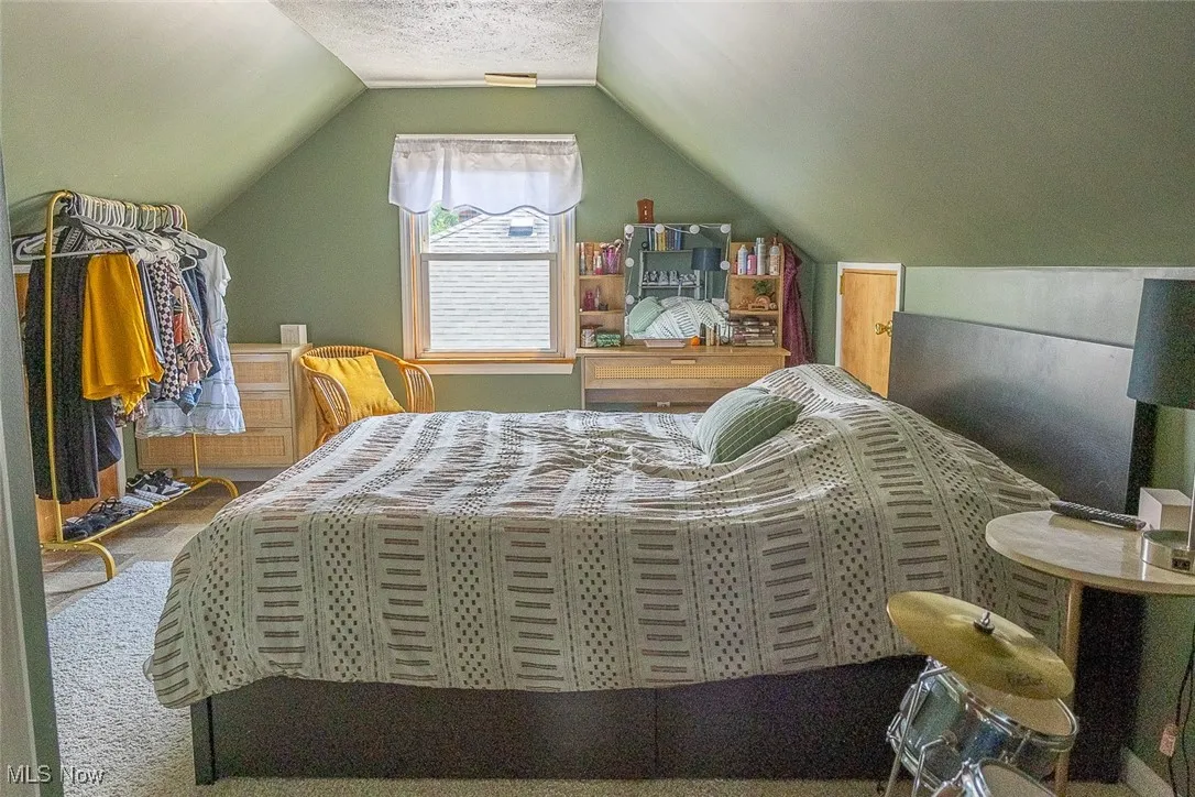 Bedroom three with lofted ceiling